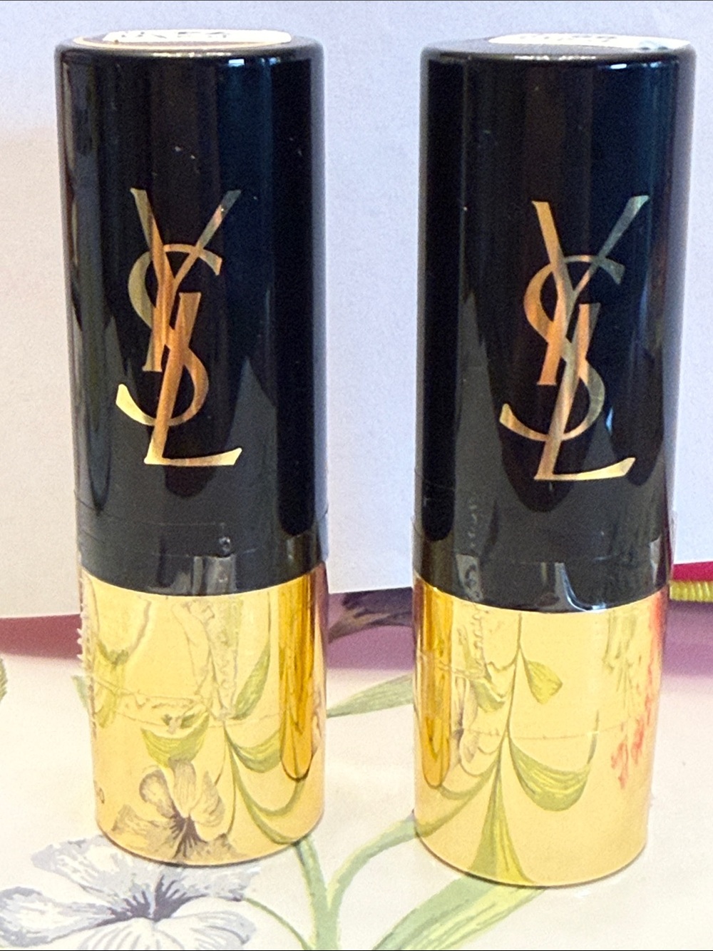 Yves Saint Laurent Black and Gold foundation in different shades.